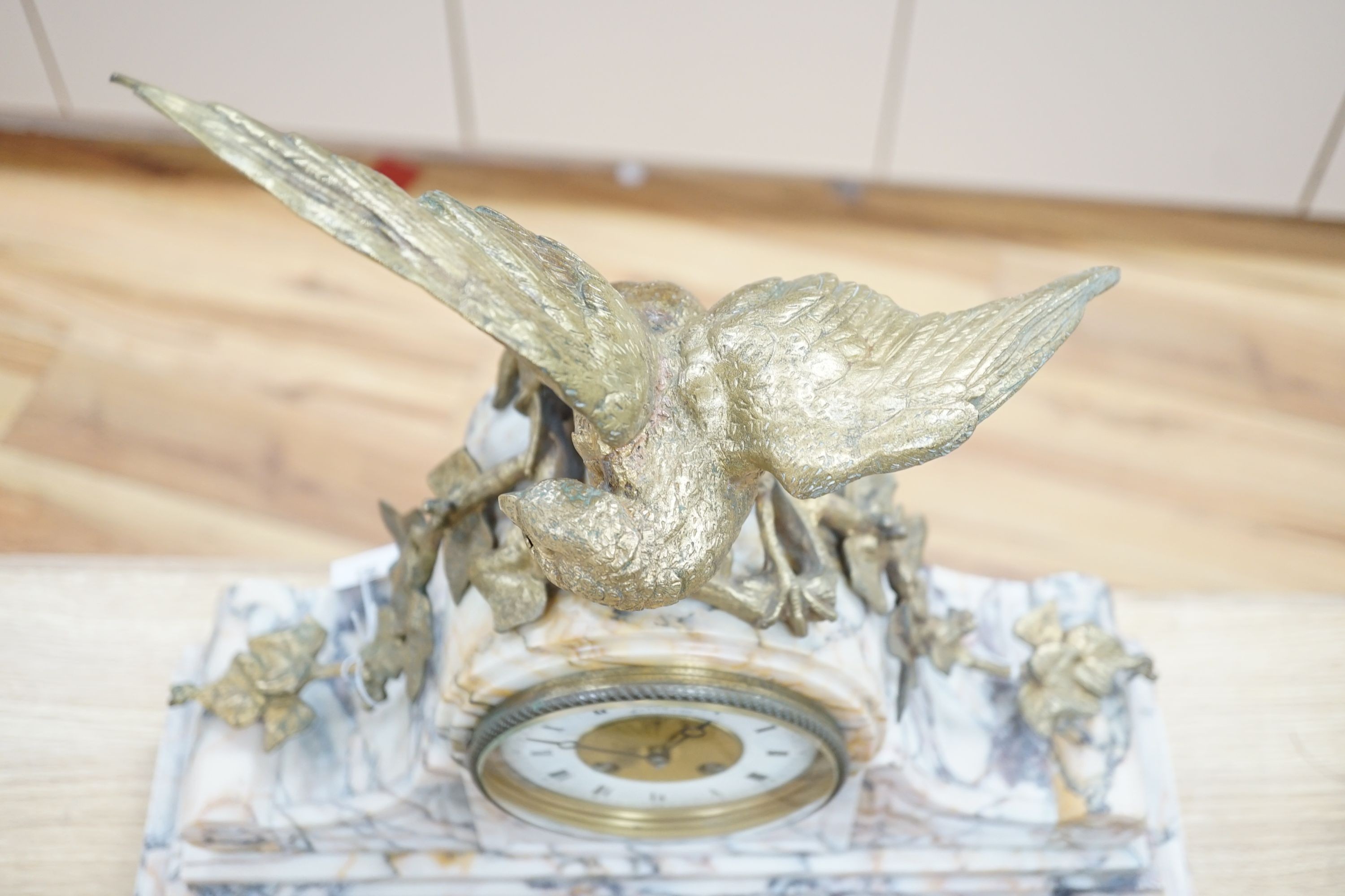 A late 19th century French marble clock garniture with bronze eagle, signed by J Moignier, height 51cm